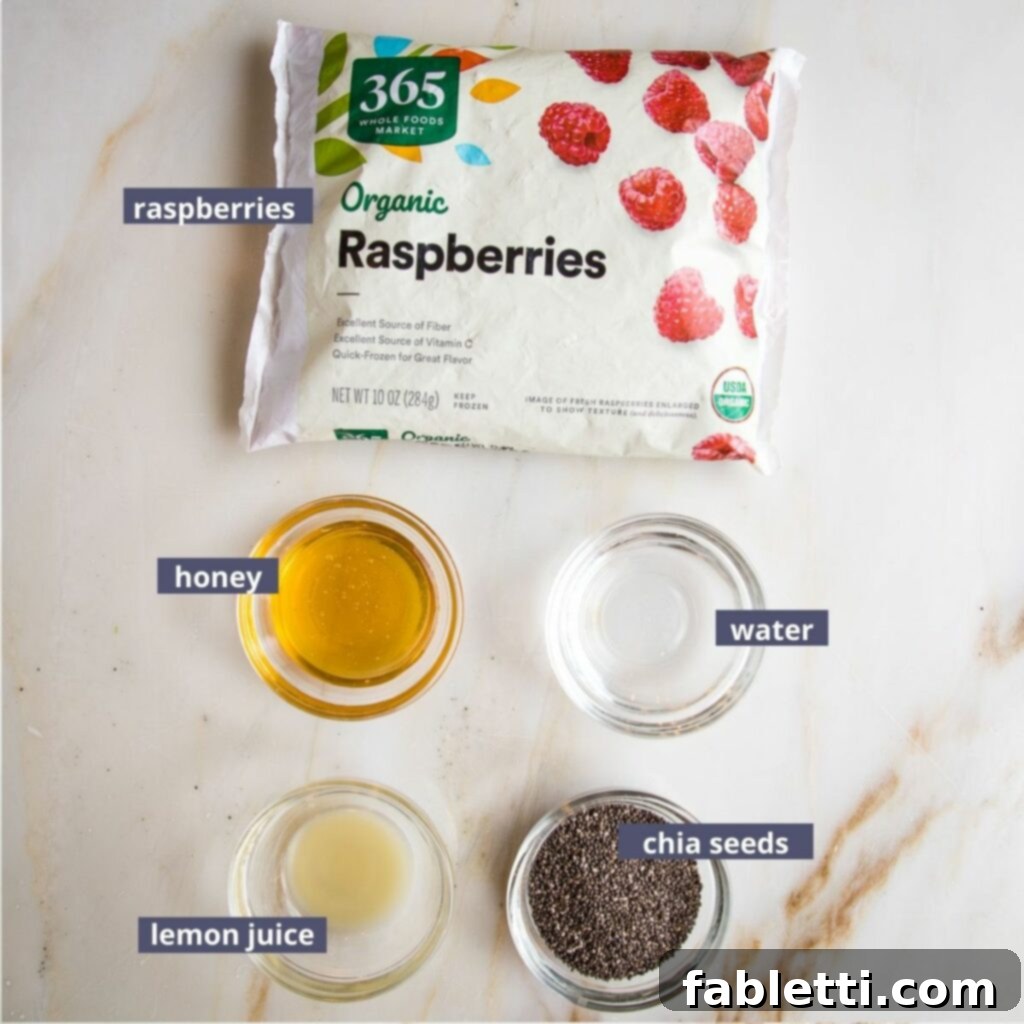 Labeled ingredients for Raspberry Chia jam: frozen raspberries, honey, water, lemon juice, chia seeds