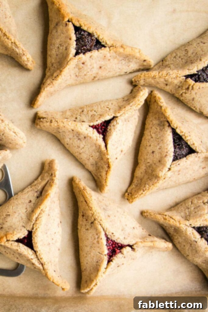 Poppy seed and jam filled hamentaschen baked to golden perfection. 
