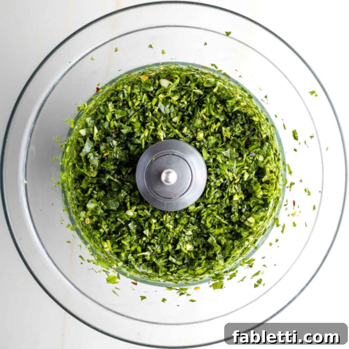 Golden Seared Cauliflower Steaks with Herbaceous Chimichurri 14 Chopped herbs, garlic and crushed pepper in the bowl of a food processor.