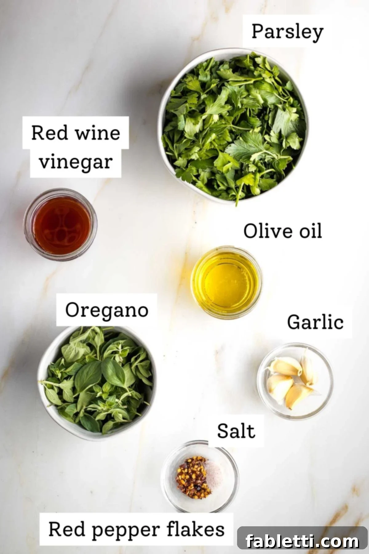 Golden Seared Cauliflower Steaks with Herbaceous Chimichurri 5 Labeled ingredient photo: parsley, red wine vinegar, oregano, olive oil, garlic, salt, red pepper flakes.