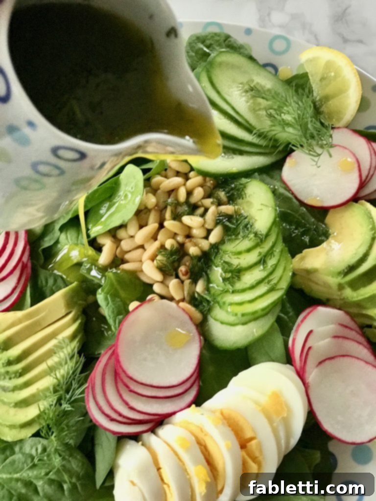 Simple Spinach Salad with a focus on the delicious, homemade lemon and dill dressing