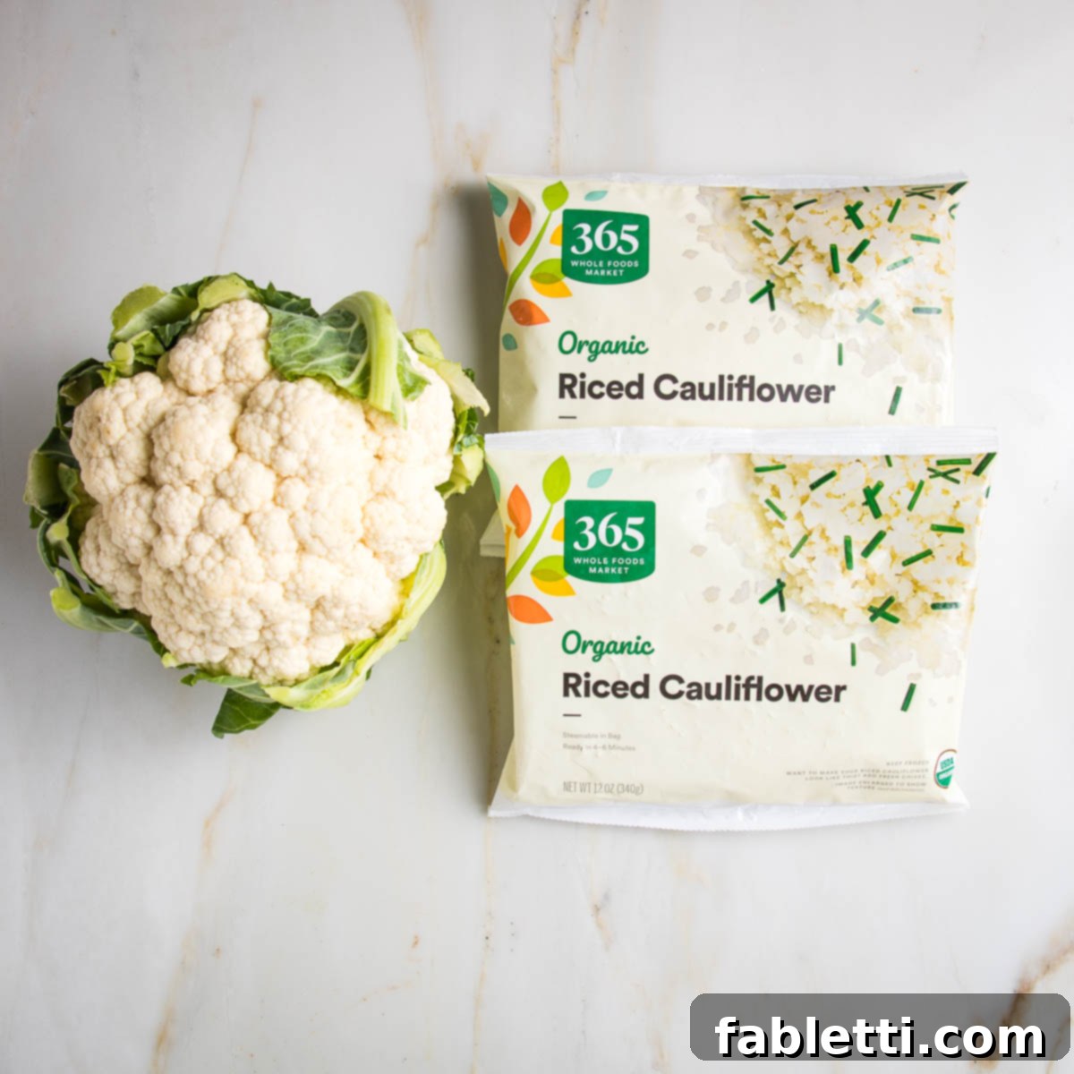 Quick Skillet Cauliflower Rice 3 A head of cauliflower and 2 packages of 365 brand organic riced cauliflower.