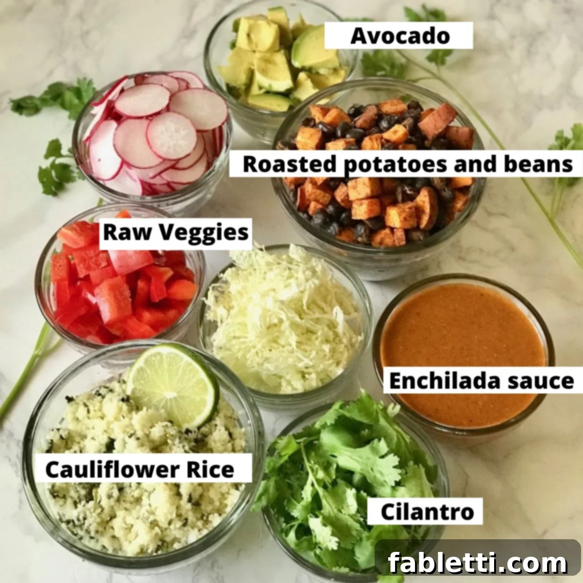 Plant-Powered Enchilada Bowls 3 Close-up of labeled ingredients for a vegan enchilada bowl, including rich enchilada sauce, perfectly roasted potatoes and black beans, a medley of crisp raw vegetables, fluffy cauli-rice, fresh cilantro, and creamy avocado slices.