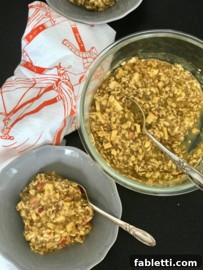 Prepared Pumpkin Overnight Oats in a jar, ready to be stirred and served for a healthy breakfast.