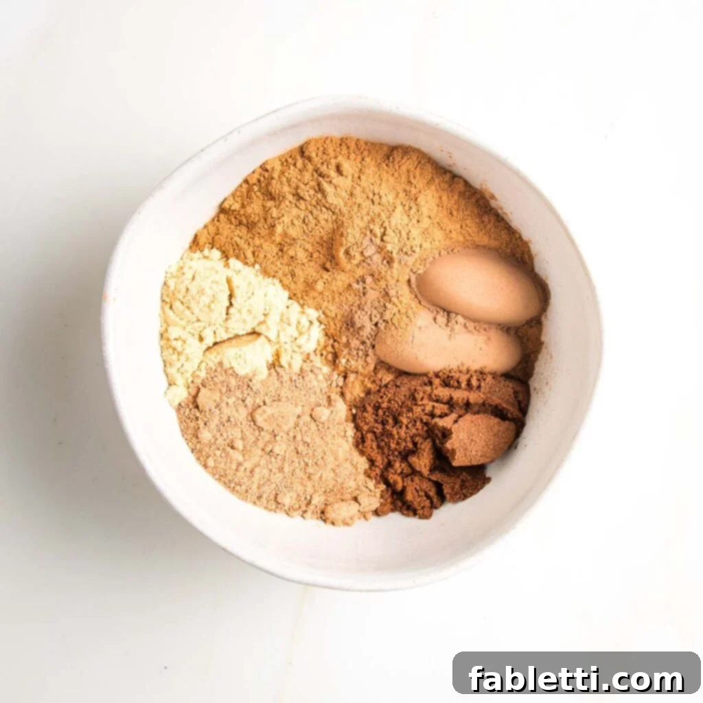 Pumpkin Spice Truffles 5 A selection of individual spices, including cinnamon sticks, whole nutmeg, ginger root, and allspice berries, ready to be combined for homemade pumpkin pie spice.