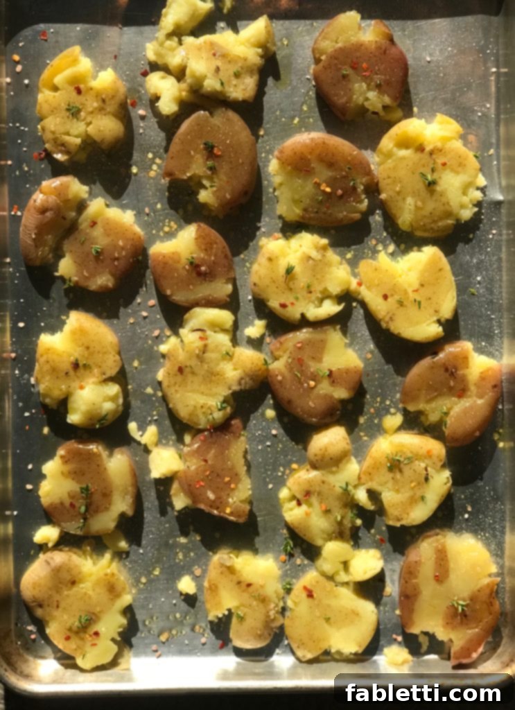 Perfectly Crispy Smashed Potatoes with Fresh Pesto 3 Boiled potatoes, smashed and ready to roast.