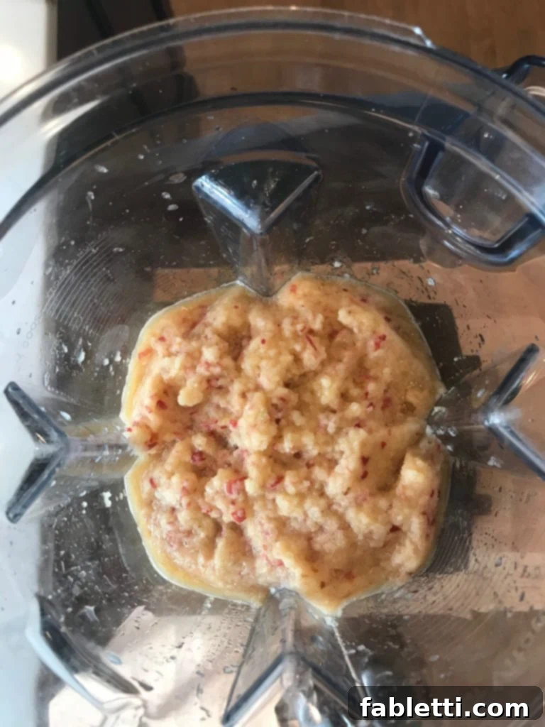 A bowl of fresh, healthy 5-Minute Raw Applesauce.