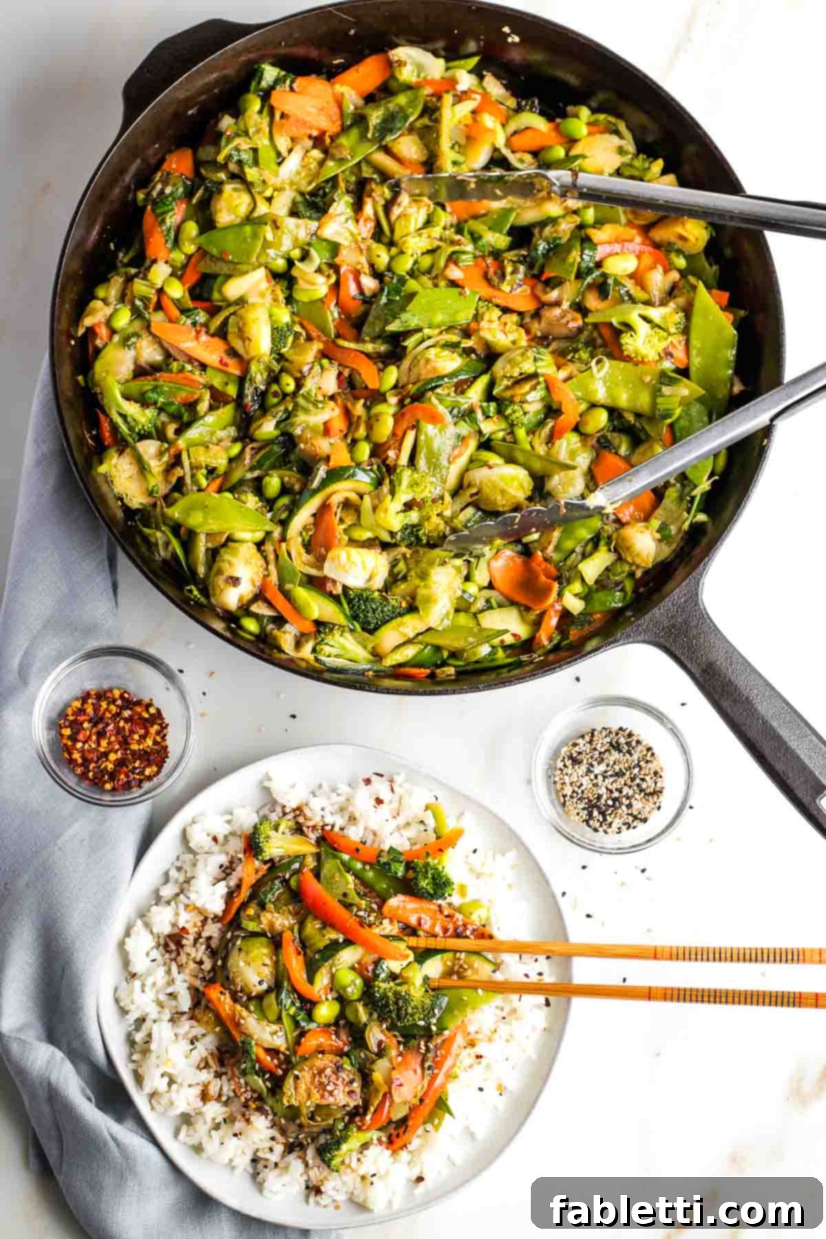 Quick and Flavorful Teriyaki Vegetable Stir-Fry 16 Large pan of stir fry veggies, plus a plate of rice topped with the vegetables.