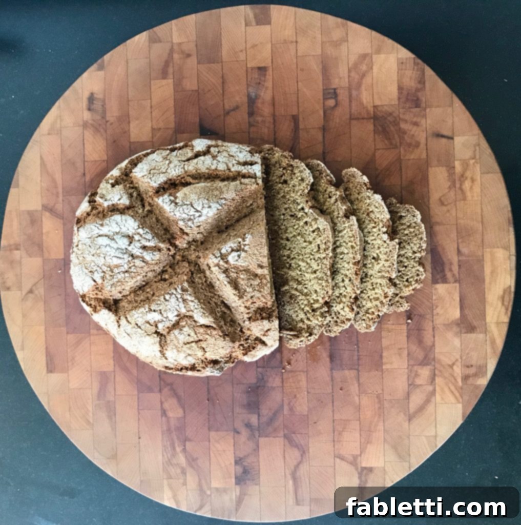 Wholesome Irish Brown Bread 7 A freshly baked loaf of whole grain Irish soda bread, sliced to reveal its hearty texture, ready for serving.