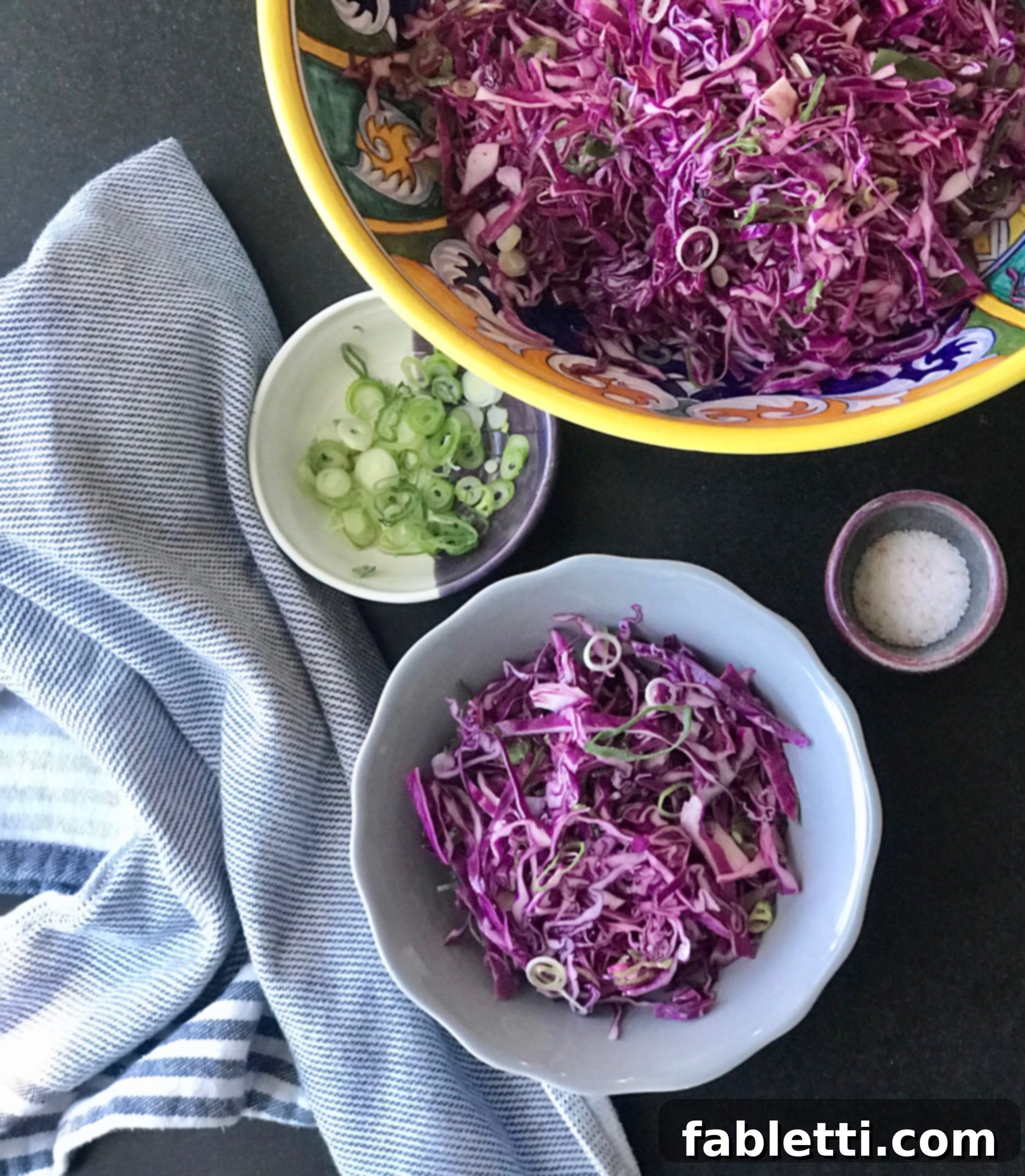 Easy Cabbage Crunch 5 Big bowl of cabbage salad plus individual serving with condiments like scallions and sea salt.