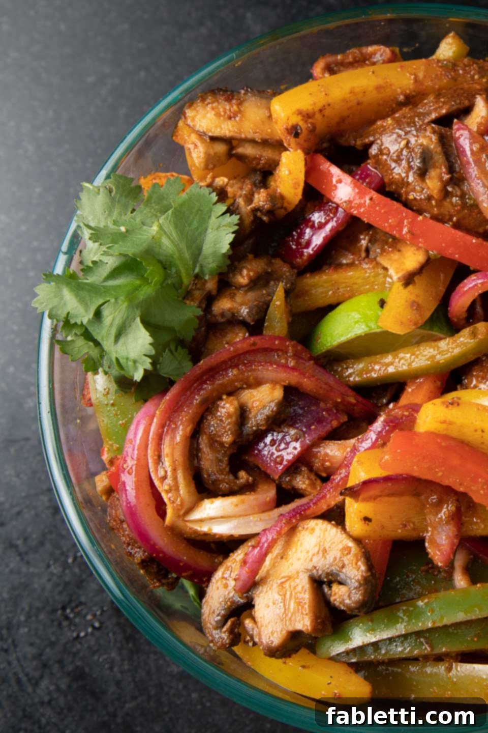Veggie Fajitas stored in glass bowl.