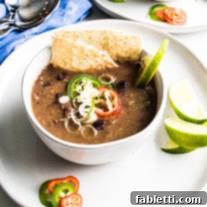 No-Fuss Black Bean Soup 14 Bowl of black bean soup with toppings
