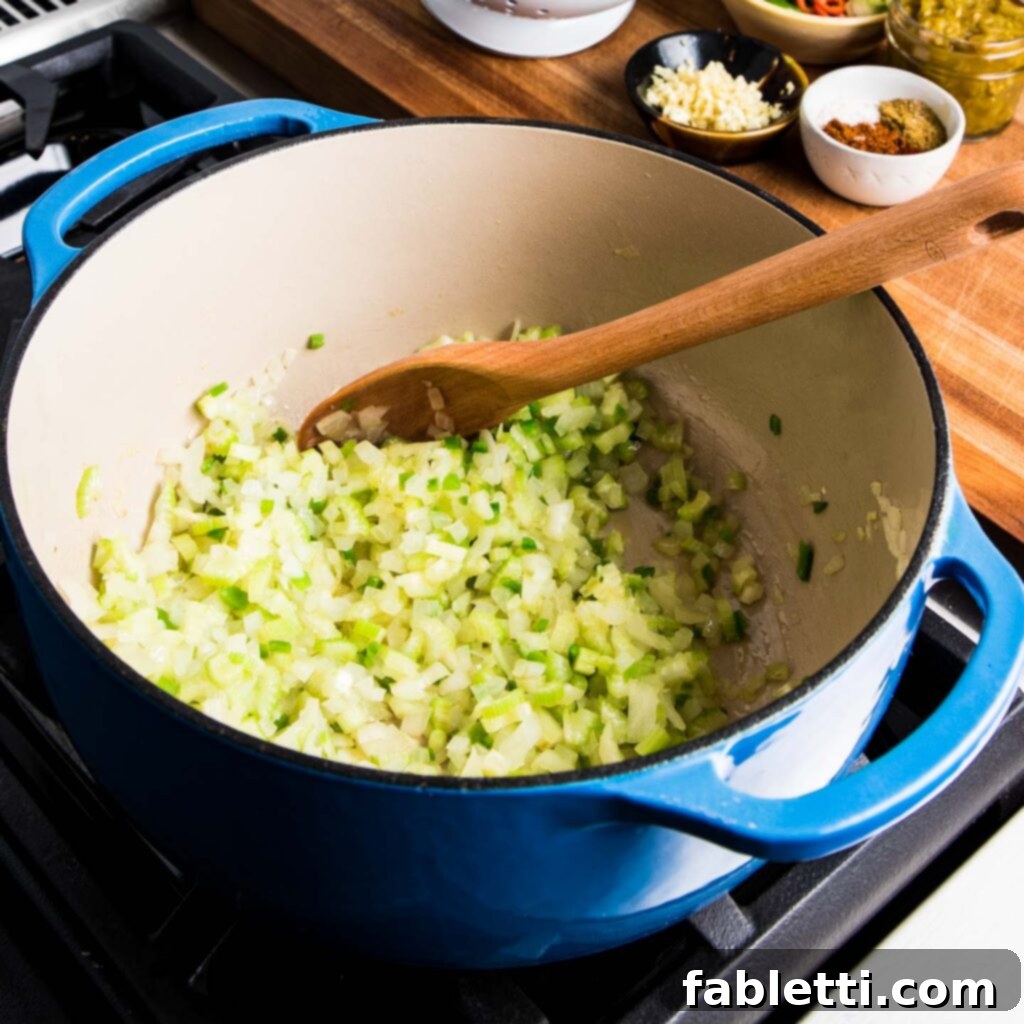 No-Fuss Black Bean Soup 6 Finely chopped yellow onion ready for cooking, a foundational ingredient for soup base.