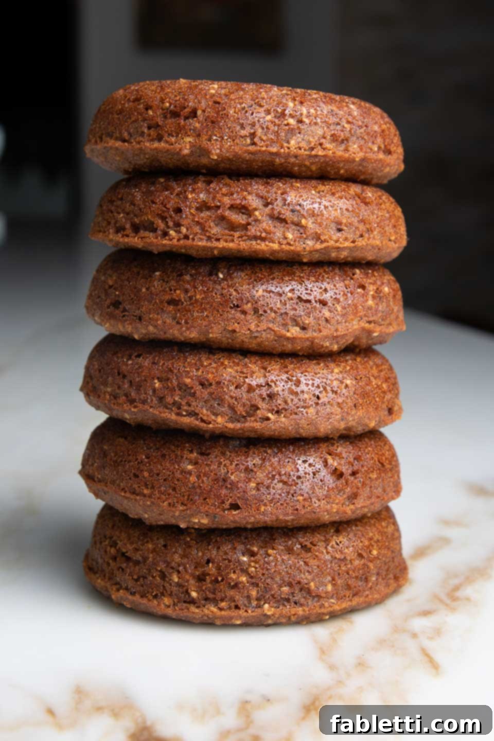 Gluten-Free Baked Pumpkin Spice Doughnuts 6 A stack of baked donuts, perfectly golden and inviting. YUM!