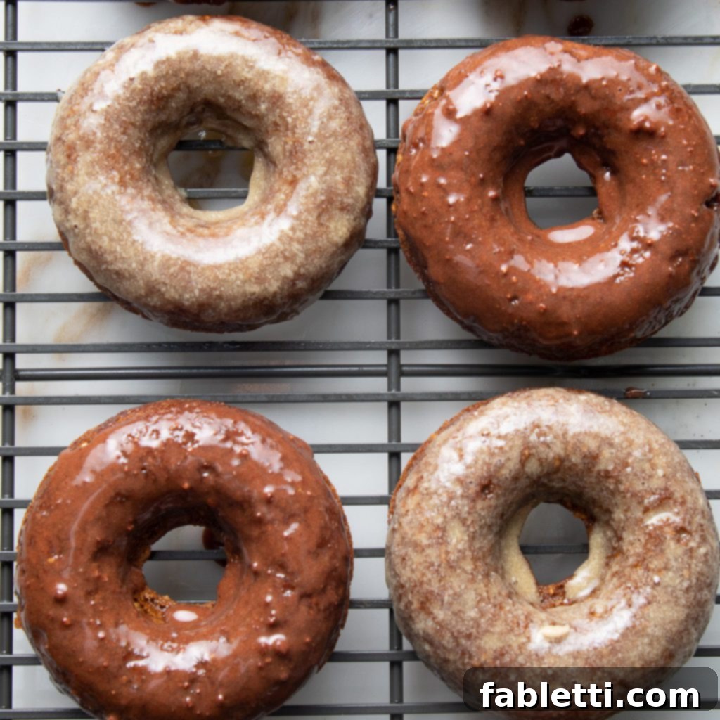 Gluten-Free Baked Pumpkin Spice Doughnuts 9 pumpkin donuts with maple and chocolate glaze, a delightful assortment.