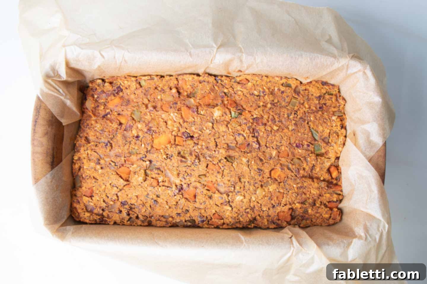 Hearty Plant-Based Meatloaf 13 The vegan meatloaf mixture is compressed and ready for baking in its loaf pan.
