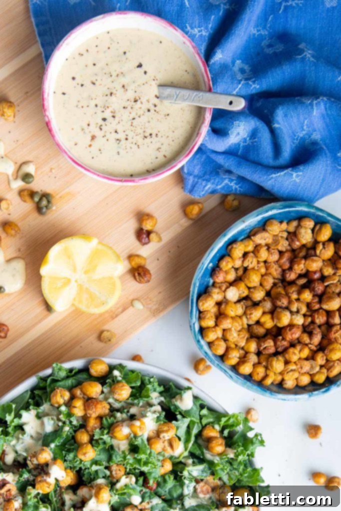 Crunchy roasted chickpeas sprinkled generously over massaged kale with creamy Caesar dressing
