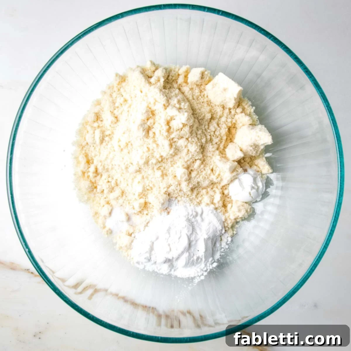 Guilt-Free Chocolate Chunk Bliss 5 Flour, baking powder and arrowroot powder in a bowl.