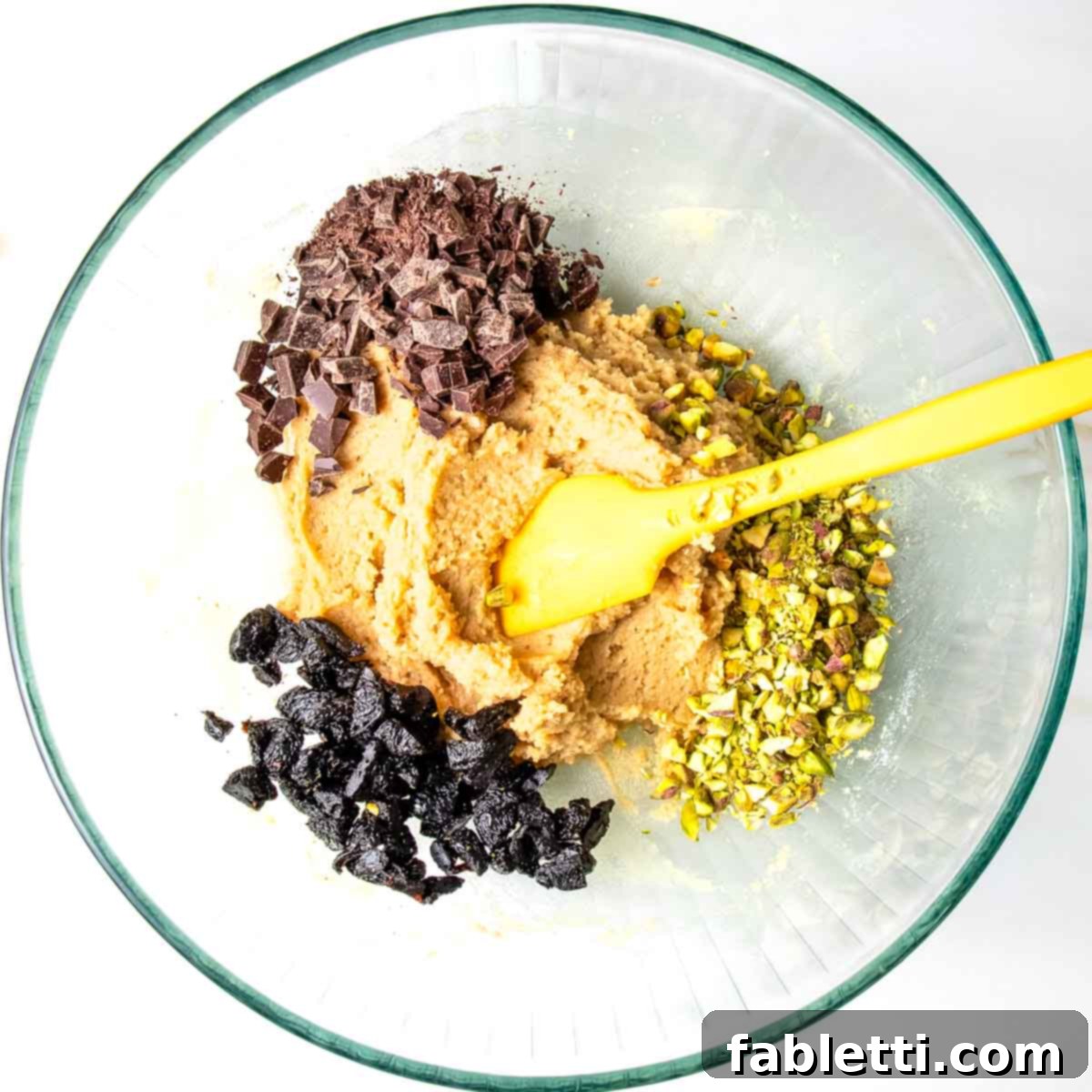 Guilt-Free Chocolate Chunk Bliss 7 Cookie batter, chocolate chunks, pistachios and dried cherries.