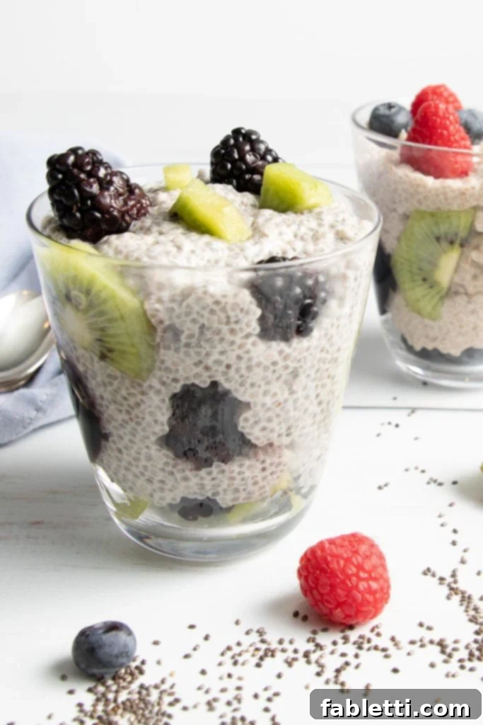 Creamy Vanilla Chia Pudding 2 Vanilla Chia Pudding in a glass topped with kiwi and berries, showcasing a simple yet decadent taste.