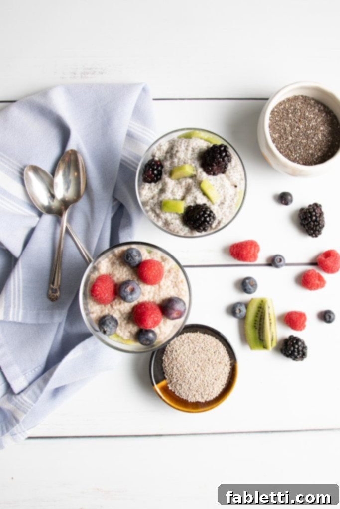 Creamy Vanilla Chia Pudding 5 Two parfaits, one made with white chia seeds on the bottom left and the other with black chia seeds on top, demonstrating the visual difference.