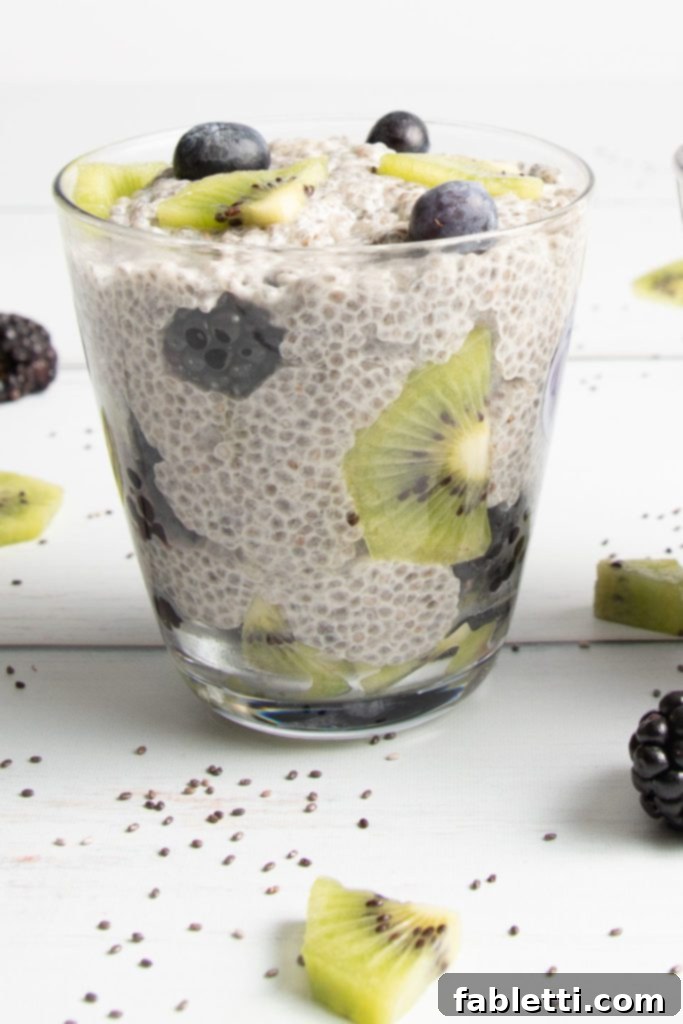 Creamy Vanilla Chia Pudding 7 Chia Seeds, kiwi, and berries arranged for a beautiful parfait, emphasizing its nutritious, delicious, tasty, and beautiful qualities.