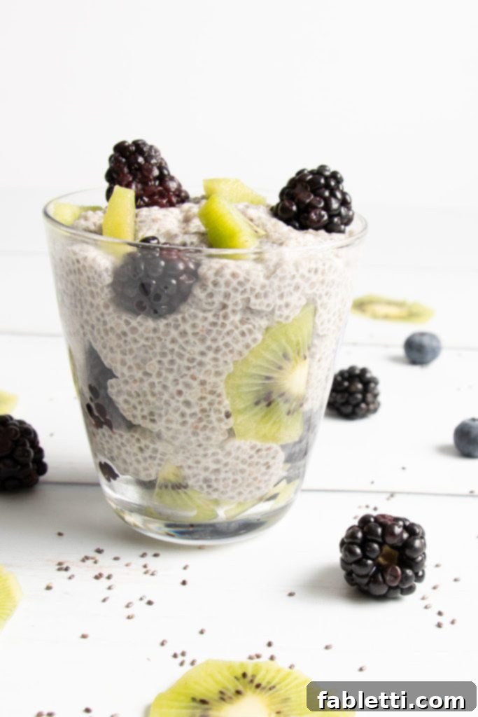 Creamy Vanilla Chia Pudding 8 Chia Pudding in a glass with kiwi and blackberries, presented as a delicious parfait.