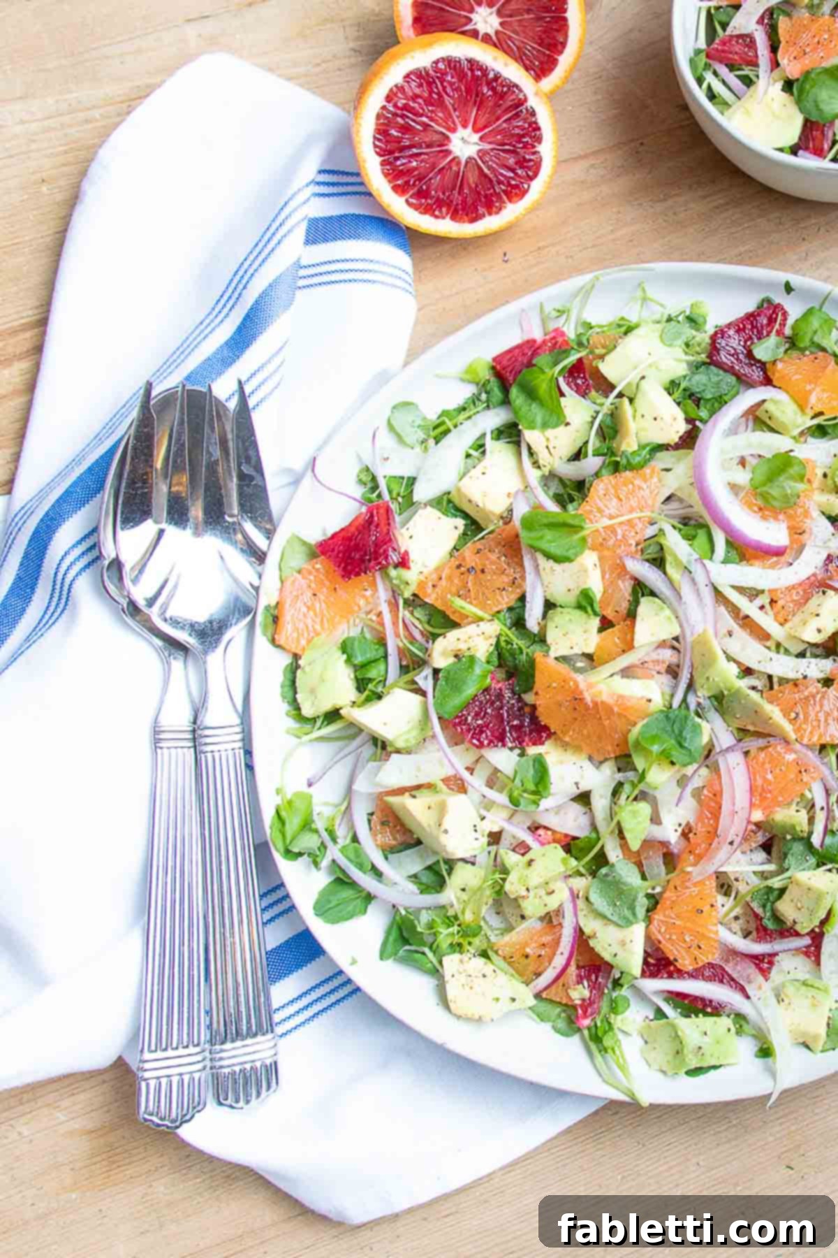 Radiant Orange Fennel 2 Colorful citrus salad with slices of avocado, fennel and onion too.