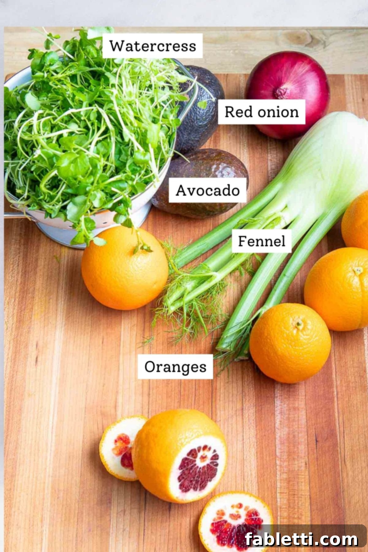 Radiant Orange Fennel 3 Labeled ingredients of whole foods: water cress, red onion, fennel, avocado, oranges.
