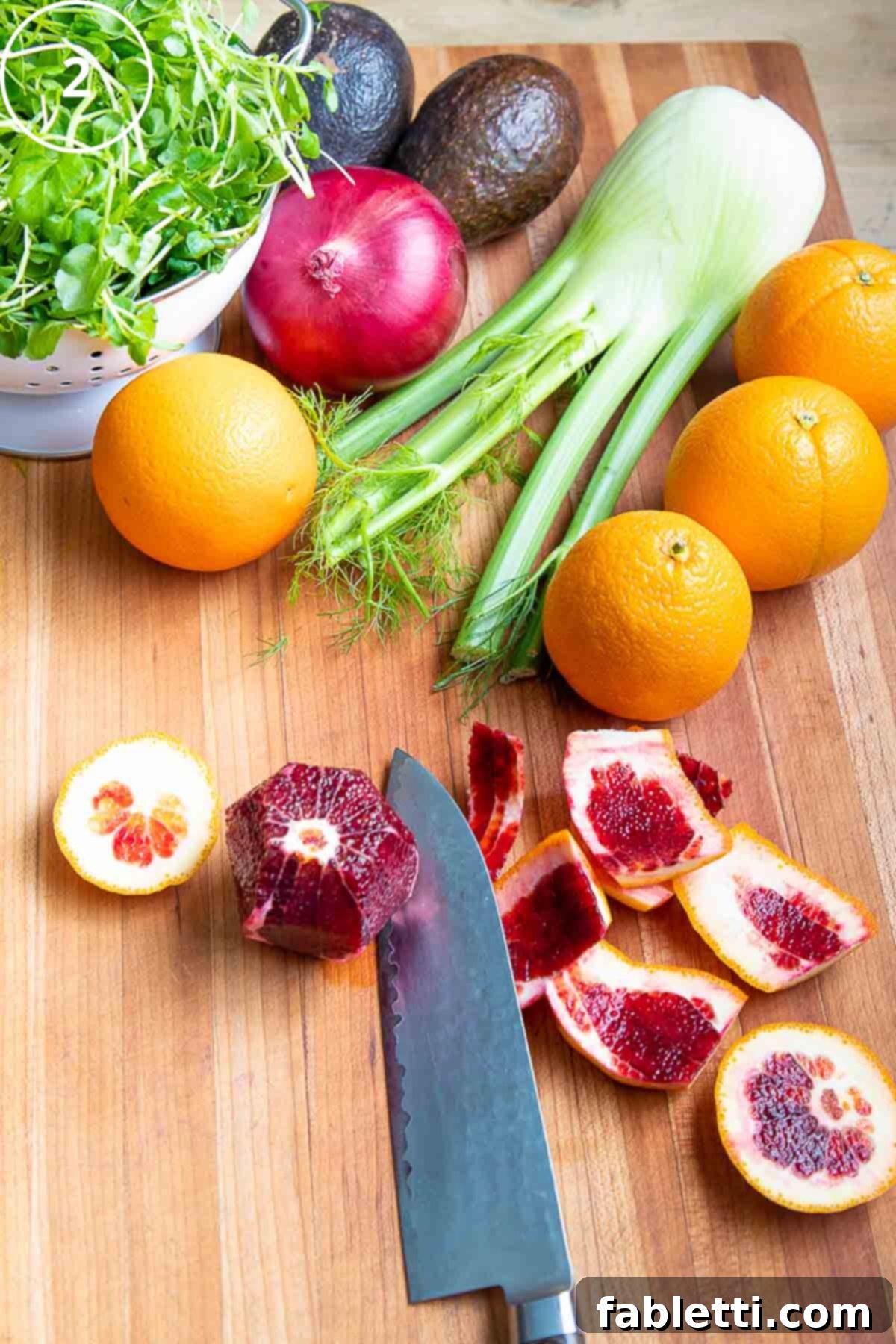Radiant Orange Fennel 6 Showing how to cut the peels away from a blood orange.