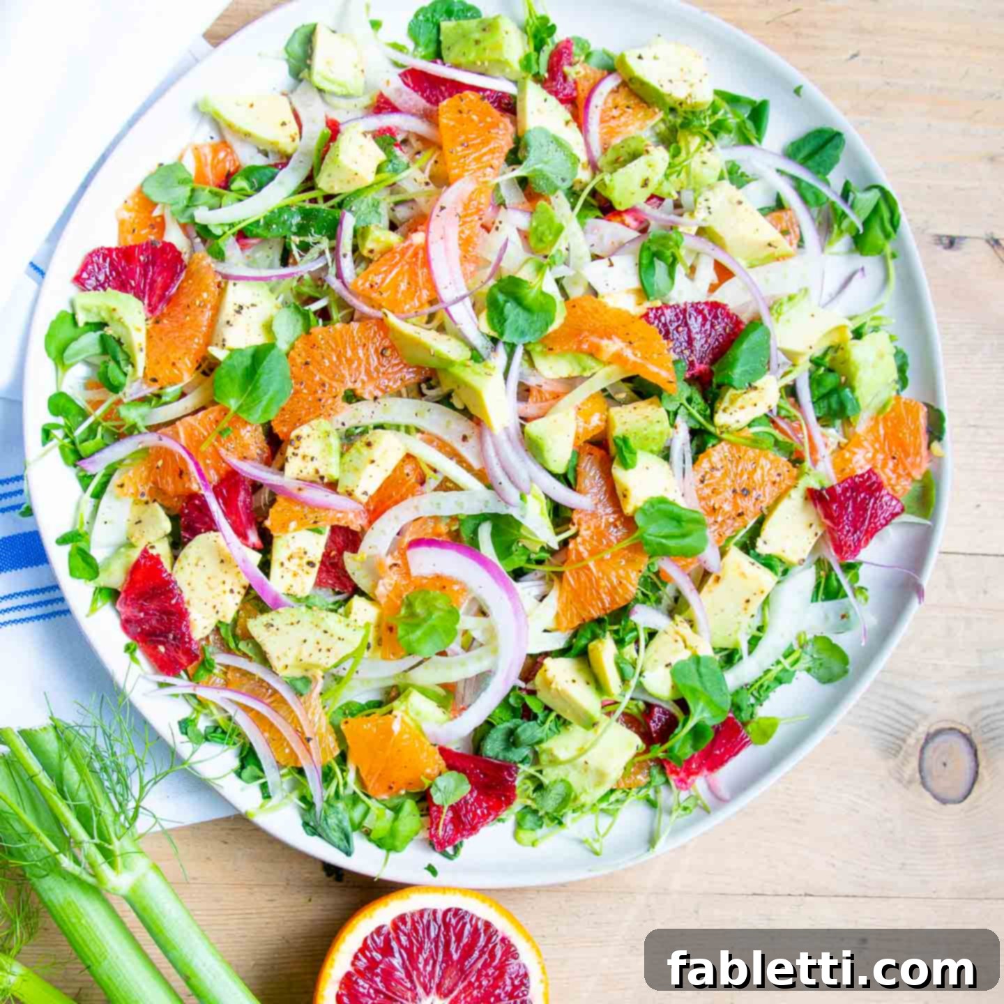 Radiant Orange Fennel 9 Bright and beautiful oranges, raw fennel slices, purple onions and avocado on top of a bed of watercress.
