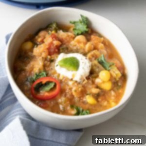 Hearty Vegan White Bean Chili 9 White Bean Chili with colorful garnishes
