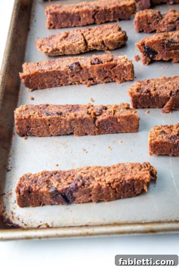 Plant-Based Biscotti Perfection 6 thick slices of biscotti on a baking tray.