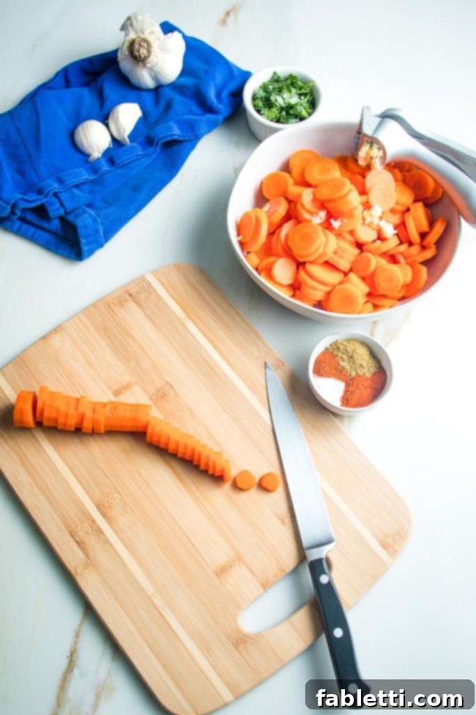 slicing whole cooked carrots