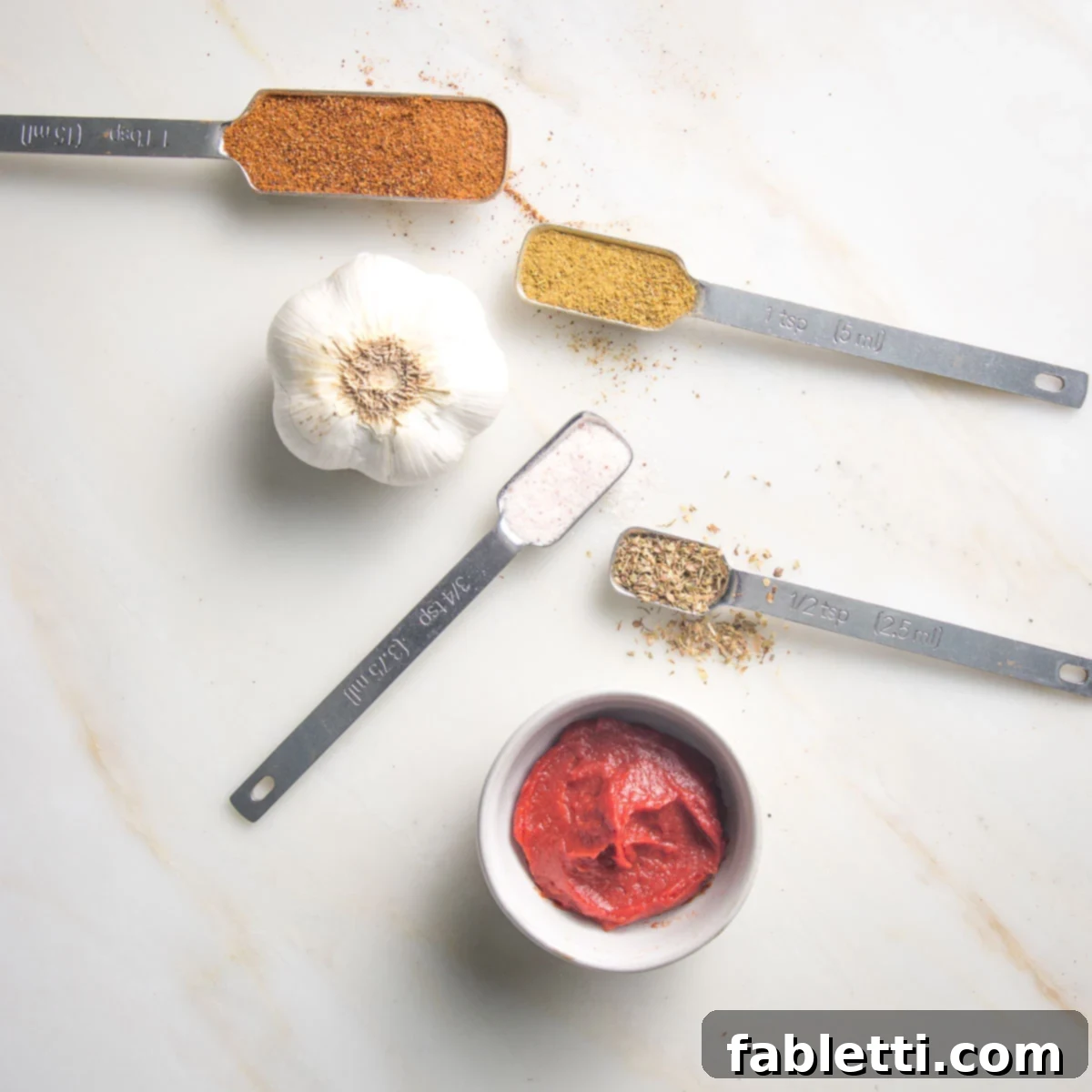 Chili powder, cumin, oregano, salt, garlic and tomato paste.