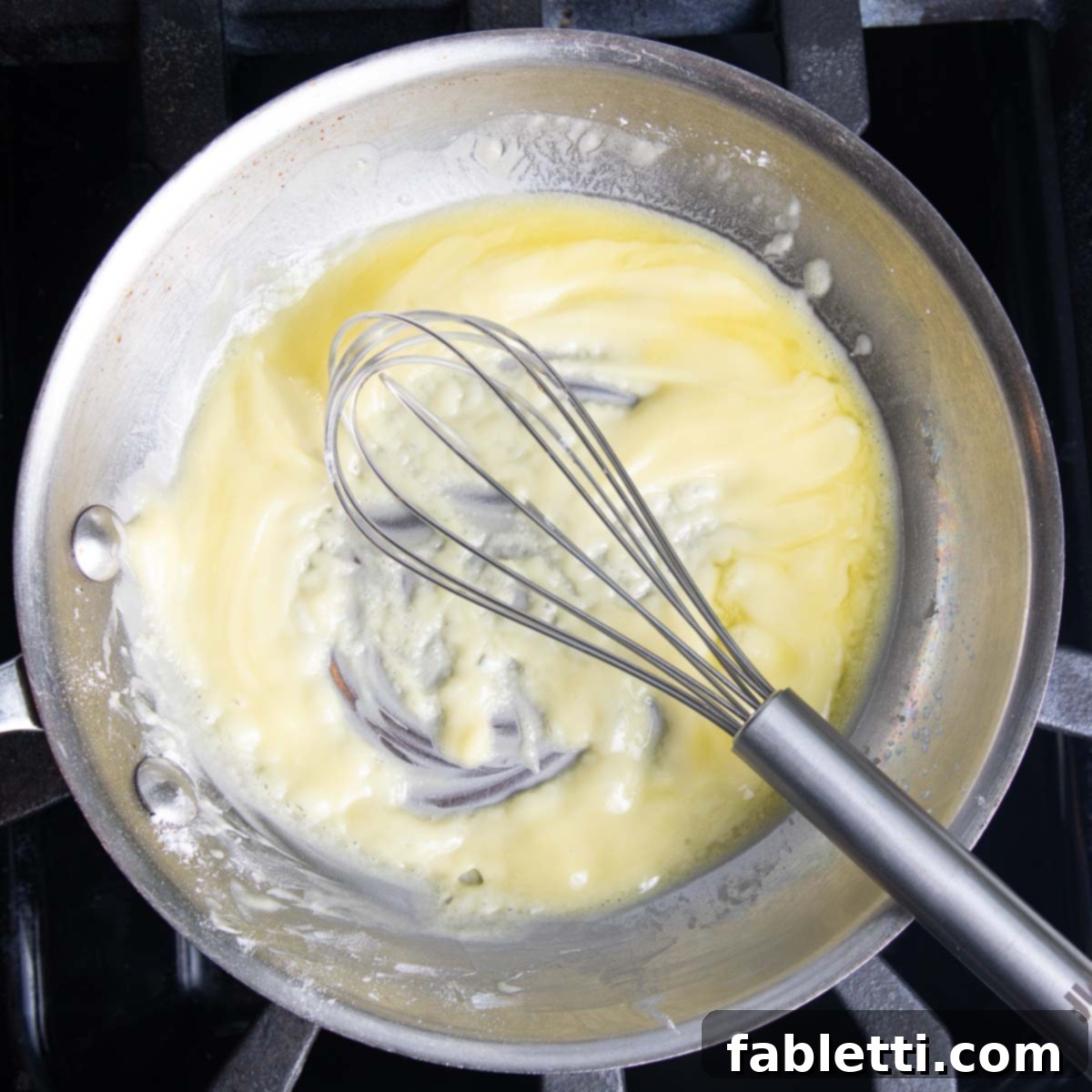 Whisking arrowroot powder into olive oil