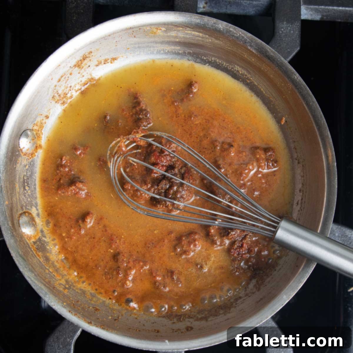 A paste of spices and tomato paste thinned by stock.
