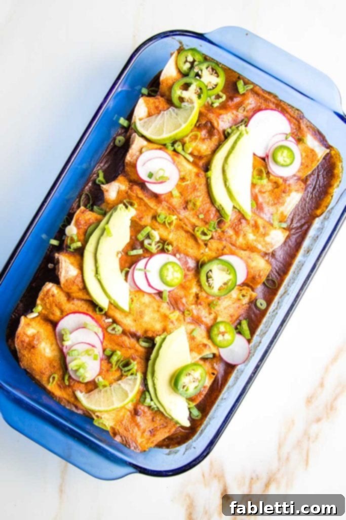 Hearty Plant-Based Enchilada Bake 12 A selection of fresh toppings for vegan enchiladas, including avocado, cilantro, and radishes.