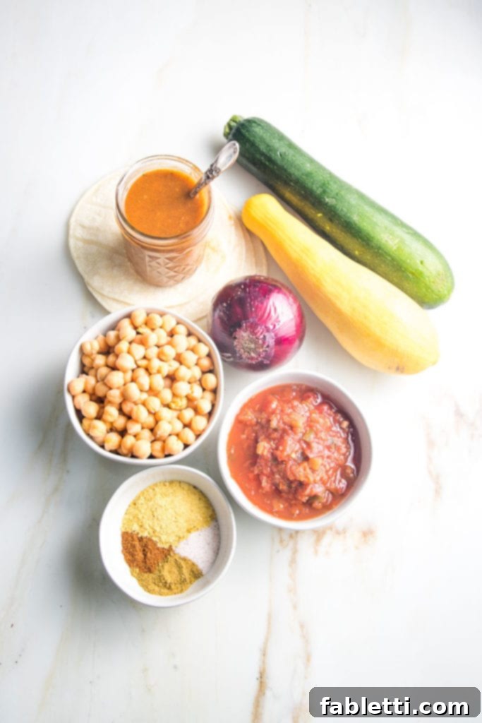 Hearty Plant-Based Enchilada Bake 3 Ingredients for enchilada casserole: beans, onion, zucchini, spices, enchilada sauce, salsa