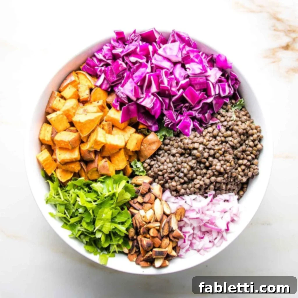Vibrant Vegan Lentil Medley 12 A colorful wheel of vegetables arranged in a large bowl, with parsley as a highlight.