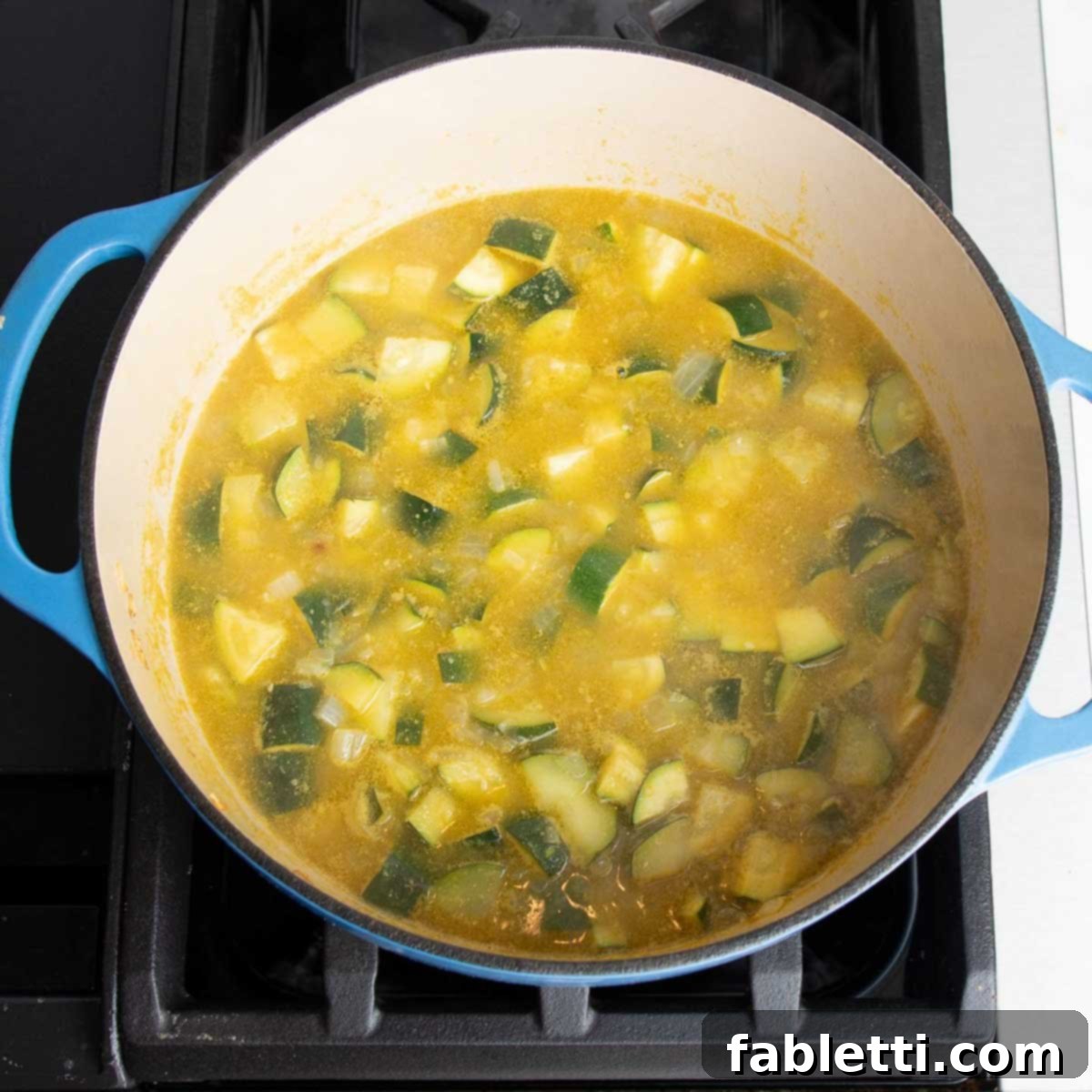 Velvety Zucchini Soup 8 Zucchini, onions and garlic in a dutch oven with broth.