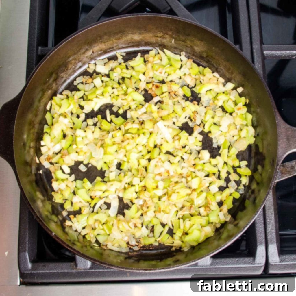 Velvety Roasted Garlic and Tahini Baba Ganoush 6 Cast iron skillet with sauteed onions and celery that are caramelized.