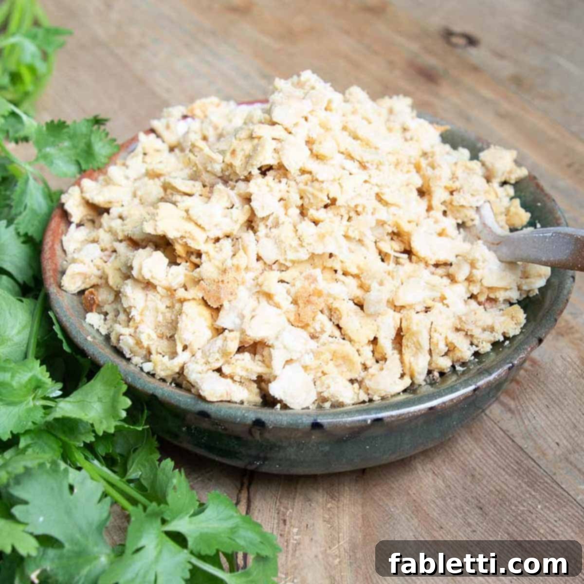 Zesty Vegan Elote 12 Crumbled vegan cheese in a bowl.