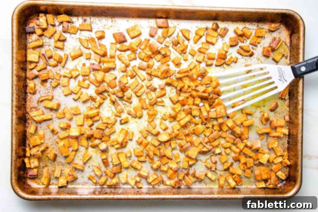 School Success Starts with Healthy Habits 4 Large rimmed baking tray with small dice sweet potatoes that have been roasted with spices.