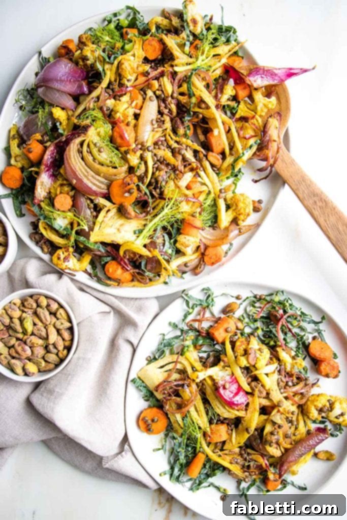 Flavorful Roasted Lentil and Vegetable Medley 2 Beautiful and brightly colored roasted veggies plus lentils, pistachios and raisins, artfully arranged on a large white plate and a smaller plate of the same.
