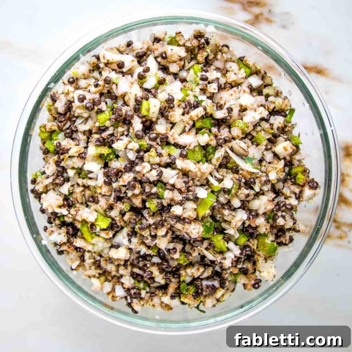 Plant-based stuffed cabbage mixture with lentils, onions, green peppers.