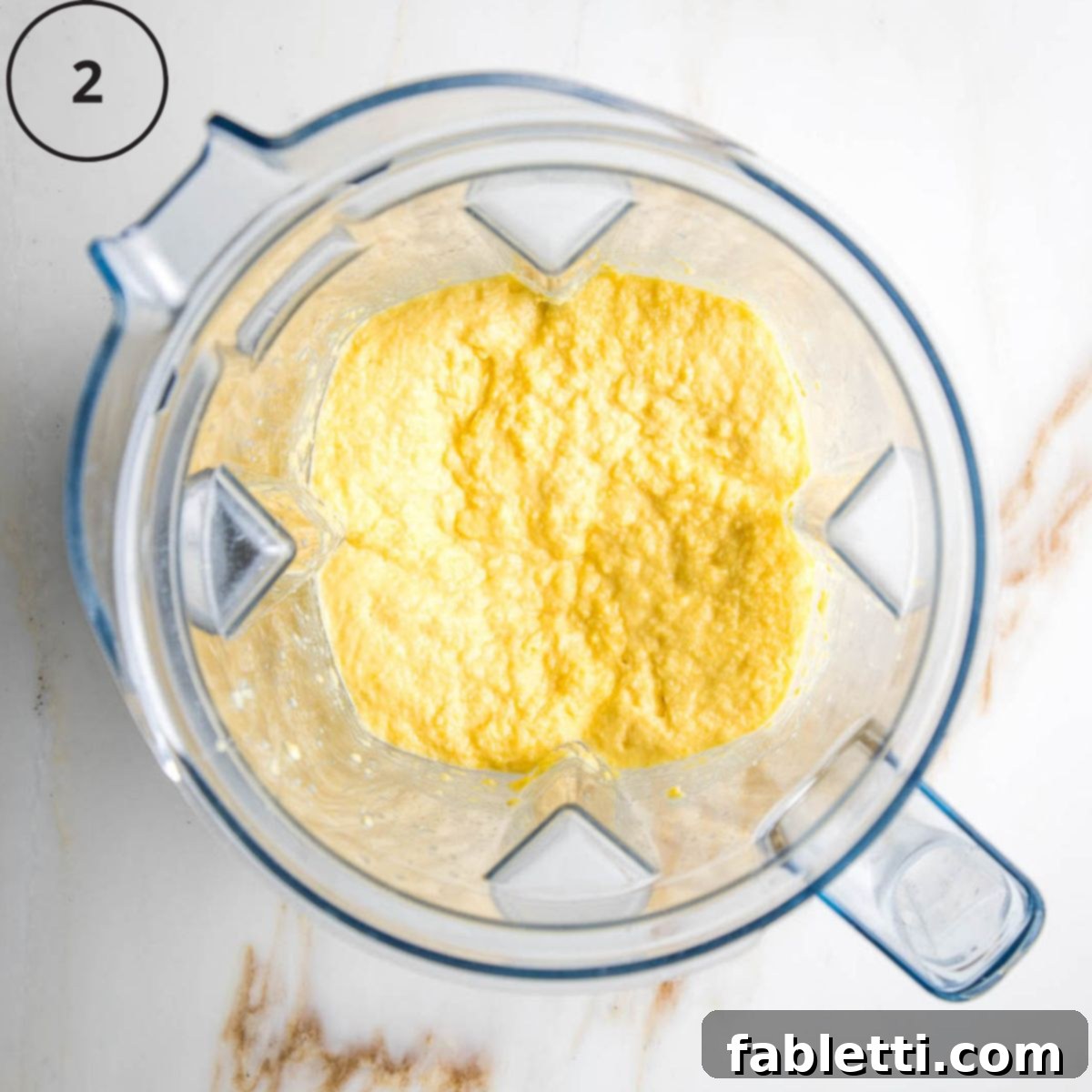 Double Corn Gluten-Free Vegan Cornbread 5 The blended corn mixture, now a thick, mushy consistency, inside the blender pitcher, ready for the next ingredients.