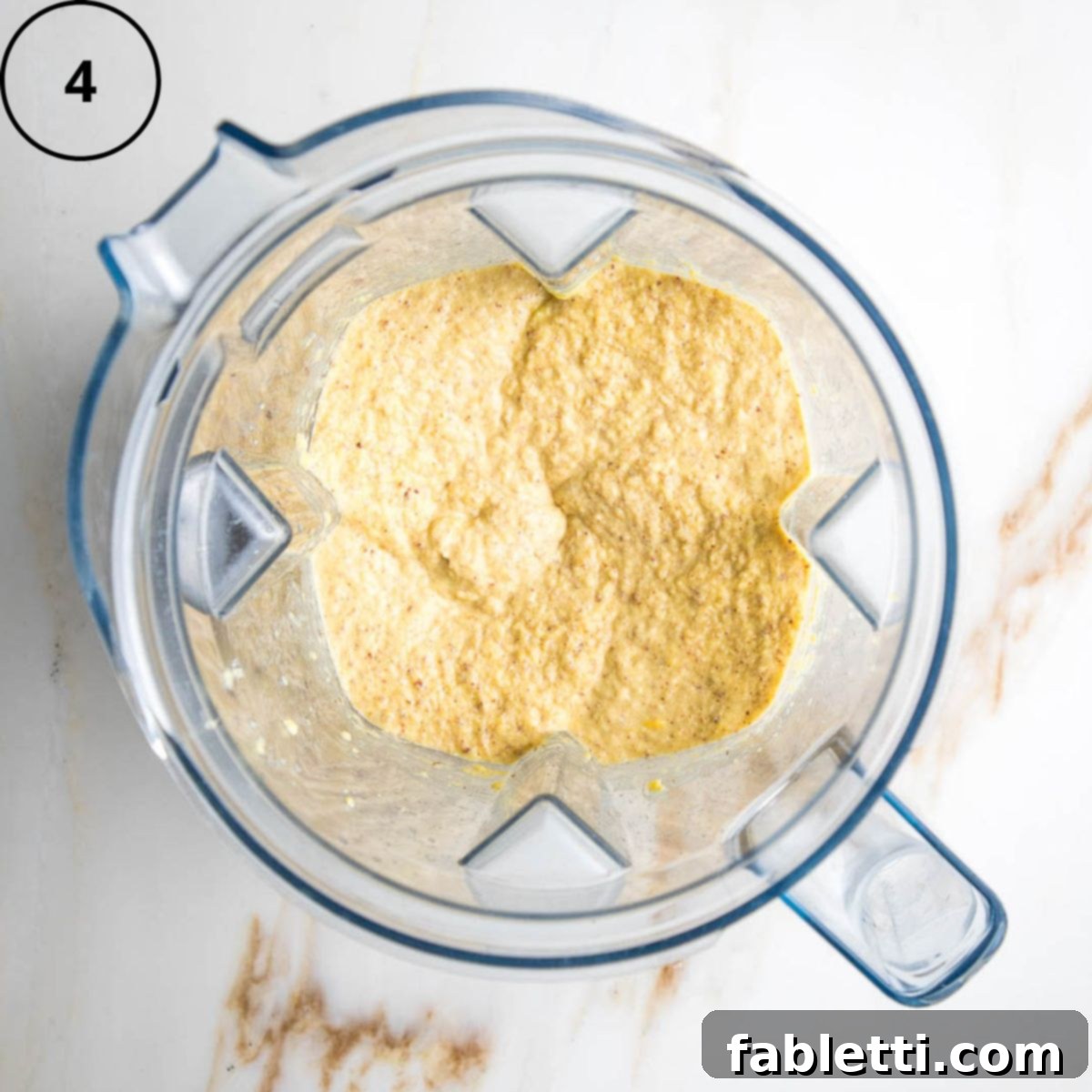 Double Corn Gluten-Free Vegan Cornbread 7 All the wet ingredients, including the corn mixture, ground flax, maple syrup, and apple cider vinegar, are thoroughly blended together in the blender until smooth.