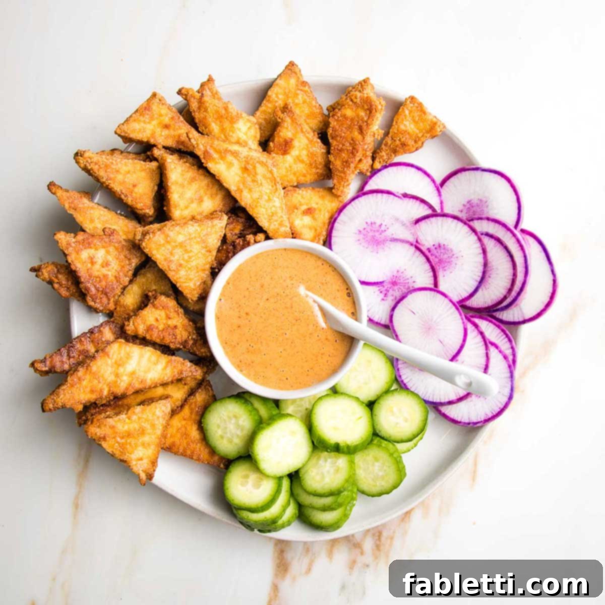Ultimate Crispy Baked Tofu 13 Crispy tofu as an appetizer with dipping sauce.