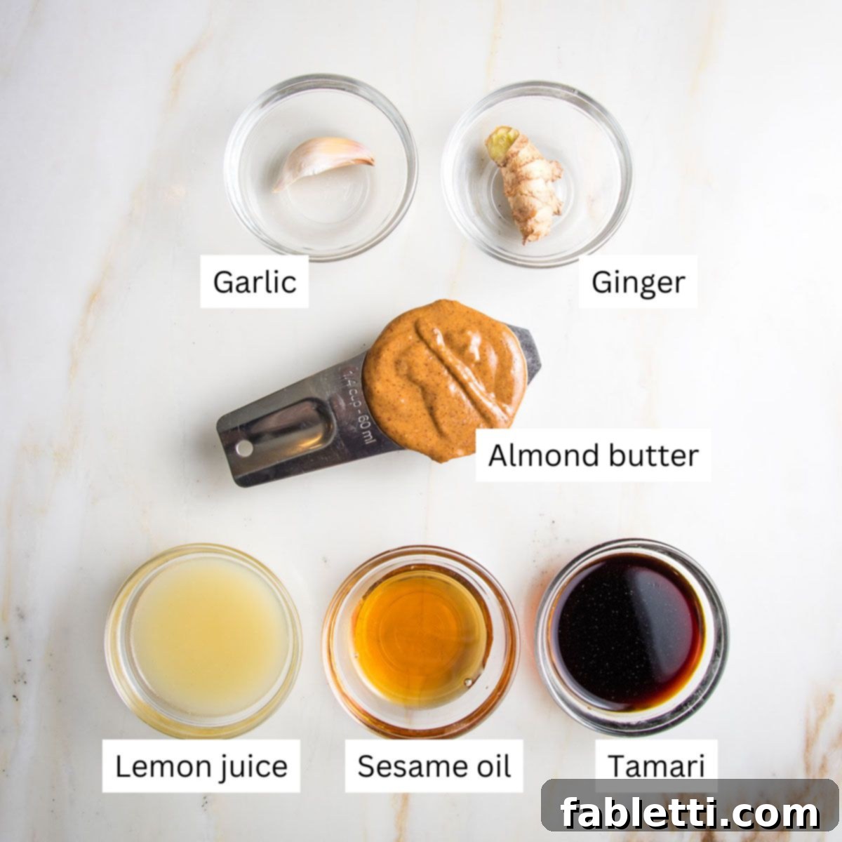 Ultimate Crispy Baked Tofu 18 Ingredients for almond butter sauce laid out.